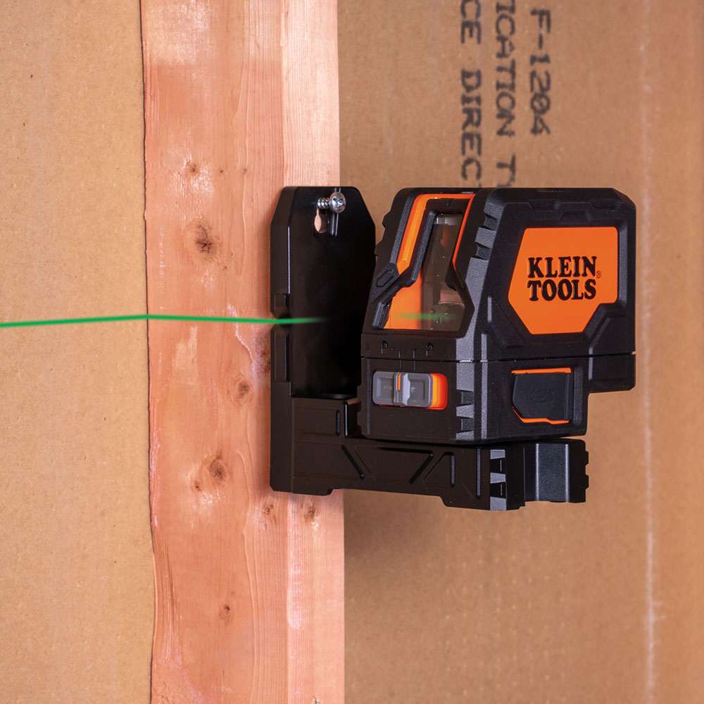 A laser level on a wood beam</p>
<p>Description automatically generated